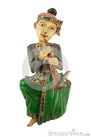 Asian vintage wood carving doll playing clarinet Stock Photo