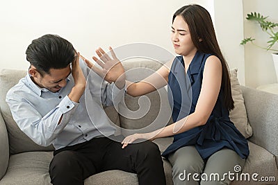Asian wife does not understand the husband explanation about the mental health problems that have occurred with his wife and Stock Photo