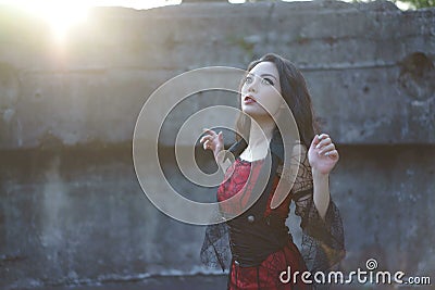 Witch woman ruin garden sunset Stock Photo