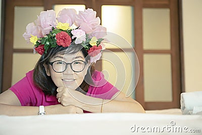 Asian woman with artificial flower bouguet decorated on head too Stock Photo