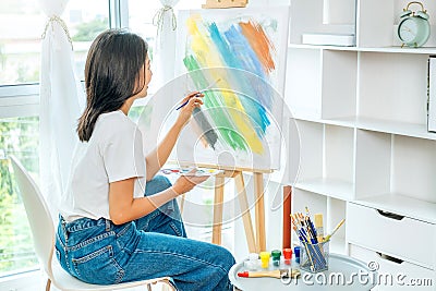 Asian Woman Artist Work and painting in the art studio at home Stock Photo