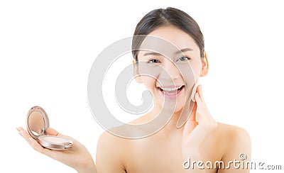 Asian woman beauty applying powder puff at cheek, cosmetics beautiful concept. Stock Photo