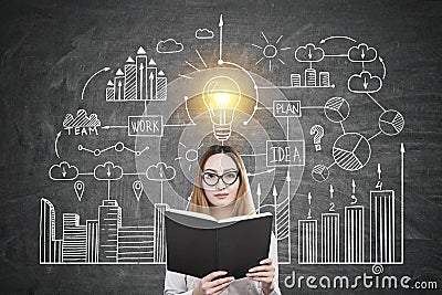 Asian woman with book and business idea Stock Photo