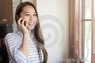 Asian woman cell phone call smile talking Stock Photo