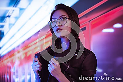 Asian Woman in the City at Night. Stock Photo