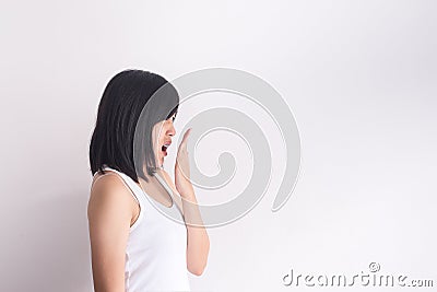 Asian woman covering her mouth and smell her breath with hand after wake up,Bad smell Stock Photo