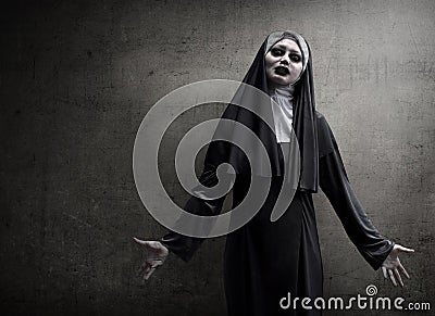 Asian woman dressed in evil nun Stock Photo