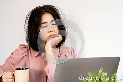 Asian woman Feeling tired or lacking energy after waking up and not feeling refreshed to start the day at the Stock Photo