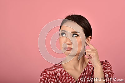 Asian woman feeling upset and frustrated, Girl rolling eyes with boredom and annoy about gossip. Stock Photo