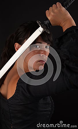 Asian woman grabbing her sword Stock Photo