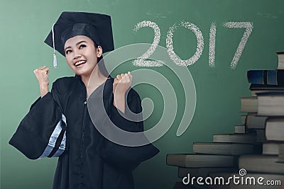 Asian woman graduate with 2017 number Stock Photo