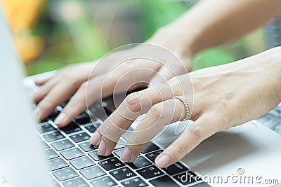 Asian woman hands and married ring has touching and typing on la Editorial Stock Photo