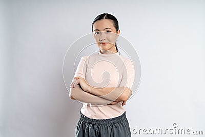 Asian woman happy confident standing crossed arms, looking at camera Stock Photo