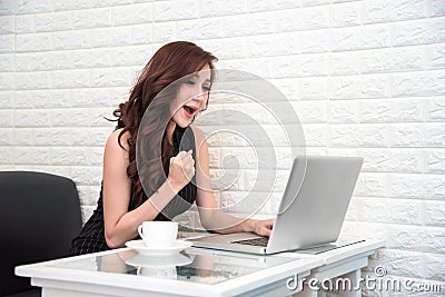 Asian woman happy after success new start up project or online b Stock Photo