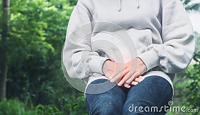 Asian woman have a bladder pain or uti pain after wake up in the morning Stock Photo