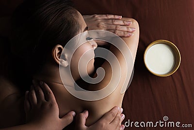 Asian woman having massage. Stock Photo