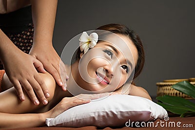 Asian woman having massage, Healthy Thai Massage Stock Photo