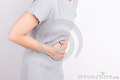 Asian woman having stomachache on white background Stock Photo