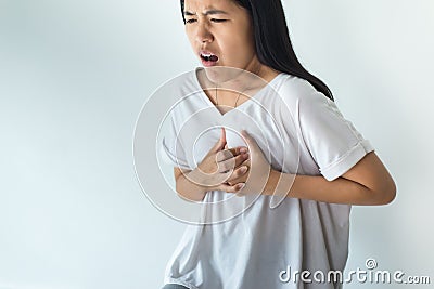 Asian woman having or symptomatic reflux acids Stock Photo