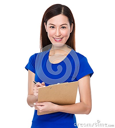Asian woman jot note on clipoard Stock Photo