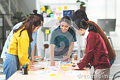 Asian woman leading business creative team in mobile application software design project. Brainstorm meeting work together concept Stock Photo