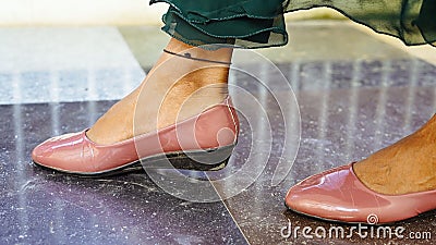 Asian woman legs in high heel shoes indoor shot Stock Photo