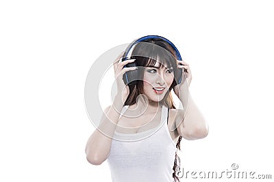 Asian woman listen music via wireless headphone Stock Photo