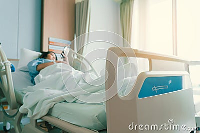 Asian woman lying sick in hospital Stock Photo