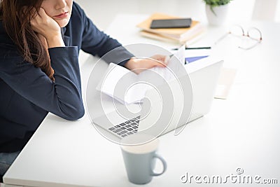 Asian woman managing her Debt Stock Photo