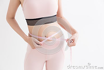 Asian woman with measure tape in her hand to measure herself,Healthy lifestyles concept of body Stock Photo