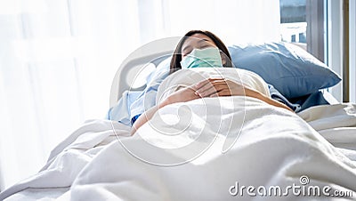 Asian woman patients wear a surgical mask Prevent the spread of germs Stock Photo