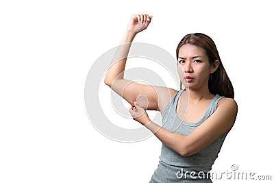 Asian woman pinching arm fat flabby skin isoloate on white background, with clipping path Stock Photo