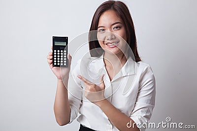 Asian woman point to calculator. Stock Photo