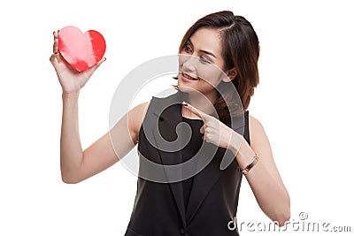 Asian woman point to red heart. Stock Photo