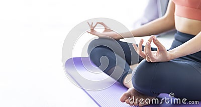 Asian woman practicing yoga indoor with easy and simple position to control breathing in and out in meditation pose Stock Photo