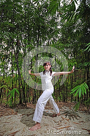 Asian Woman practising Yoga in Woods 2 Stock Photo