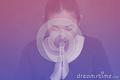 Asian Woman praying and worship to GOD Using hands to pray in religious beliefs and worship christian in the church or in general Stock Photo