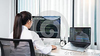 Asian Woman programmer typing source codes Programming On Computer in office, freelance web developer concept Stock Photo