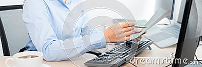 Asian woman Programming working with computer and typing data code to developing program at table In Office, technology concept Stock Photo
