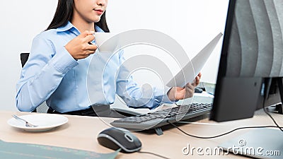 Asian woman Programming working with computer and typing data code to developing program at table In Office, technology concept Stock Photo