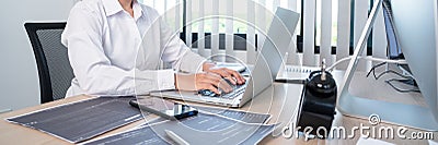 Asian woman Programming working with computer and typing data code to developing program at table In Office, technology concept Stock Photo