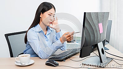 Asian woman Programming working with computer and typing data code to developing program at table In Office, technology concept Stock Photo