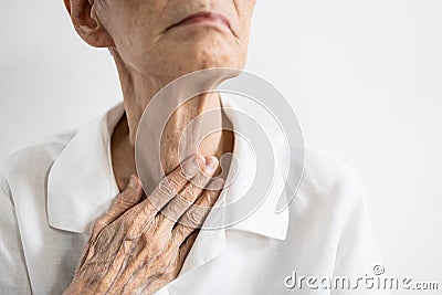 Asian woman putting her fingers in her mouth to throw up after eating food,obsessive desire to lose weight,female sticking her Stock Photo