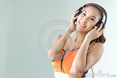 Asian women runner listening music and feeling freedom, happy and enjoying. Stock Photo