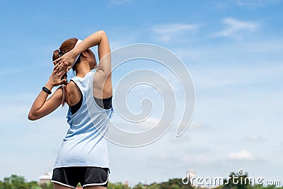 Asian Woman runner warm up before morning exercise Stock Photo