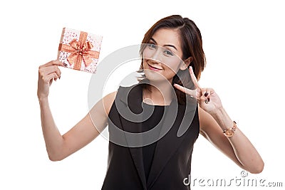 Asian woman show victory sign with a gift box. Stock Photo