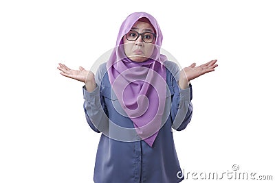 Asian Woman Shrugging Shoulder, I Don& x27;t Know Gesture Stock Photo