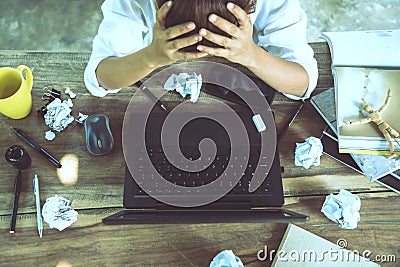 Asian woman sitting working at home on vacation. Use working with notebook. Feeling very stressed and headaches with work done Stock Photo