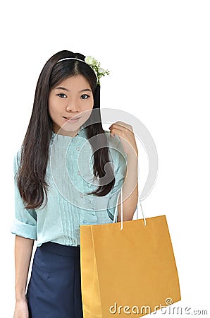 Asian woman smiling and holding shopping bag Stock Photo