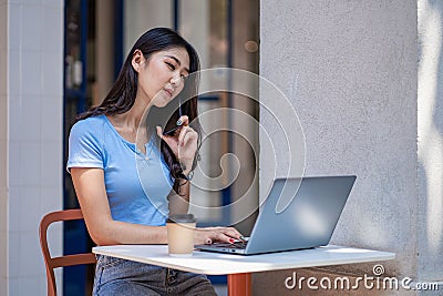 Asian woman talking on smartphone writing laptop working online beautiful girl at startup desktop, business, asia, woman, online, Stock Photo